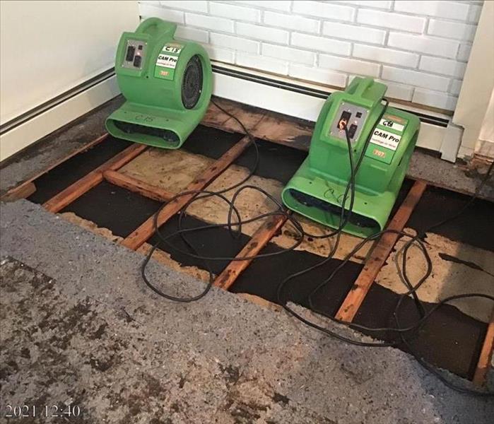 Green air mover fans drying spacer undesr subflooring