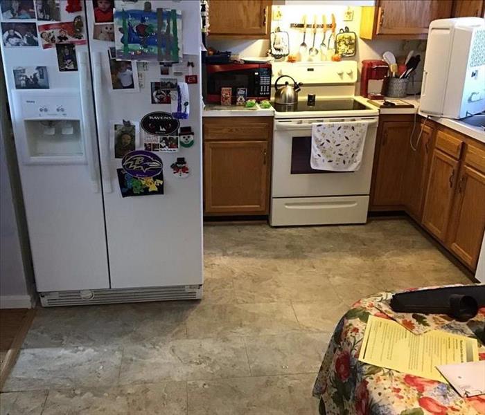 Before: Ice maker leak water damaged kitchen in Dundalk, MD
