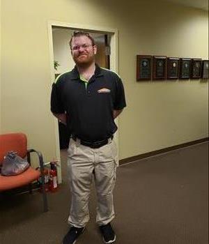 Chris Tewey, Job File Coordinator, SERVPRO of Sparrows Point / Essex / Chase, posing in the Hallway at their Location